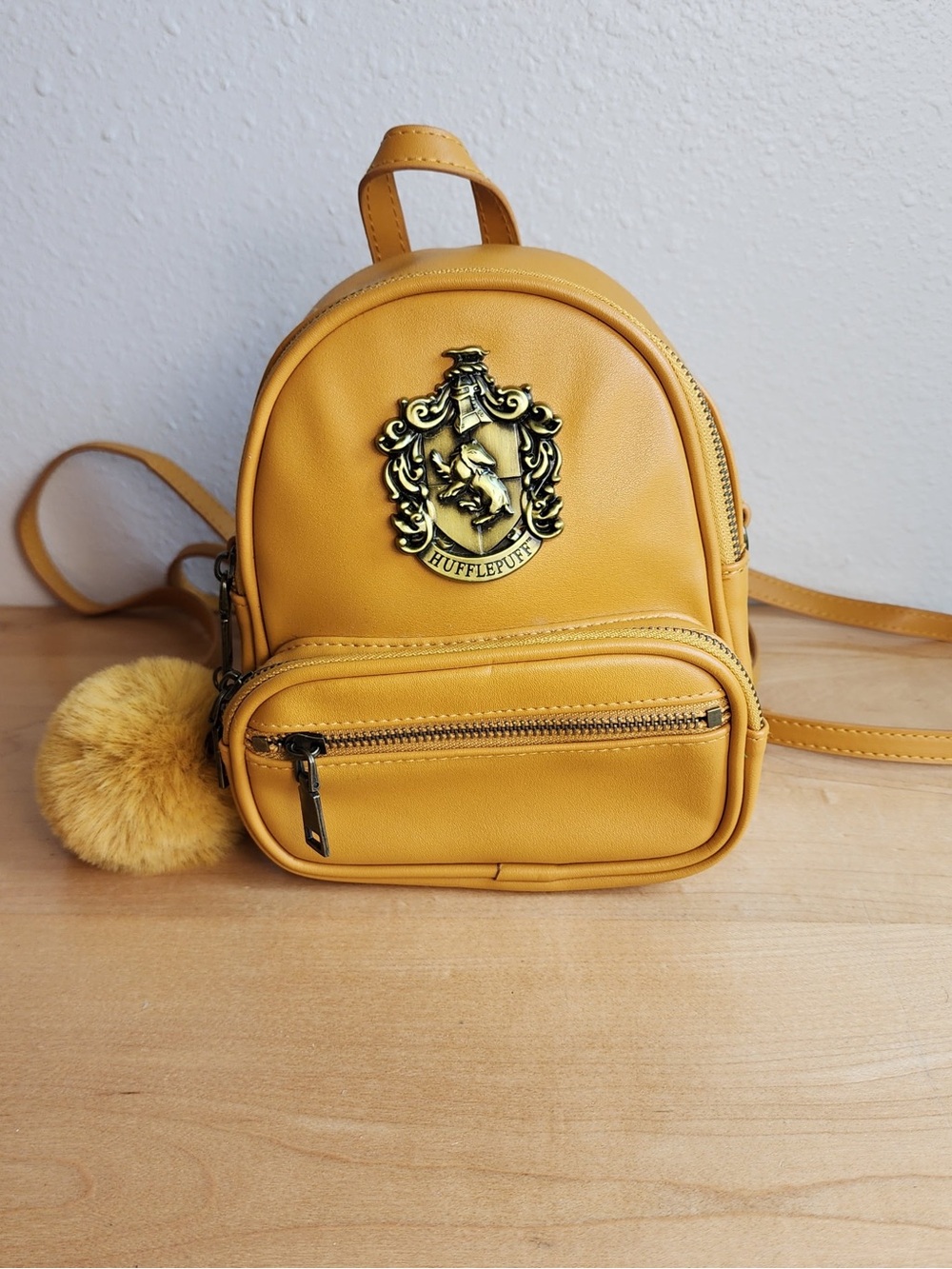 Harry Potter Hufflepuff Crest Mini Backpack Yellow Faux Leather Pom Pom NWOT